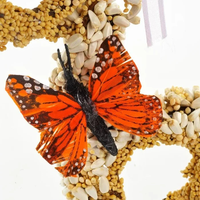 Gingerbread Men, Set of 3 (Copy): Bird-feed wreath with butterfly decoration, crafted from bird seed on grapevine, adorned with dried floral and ribbon for outdoor bird attraction.