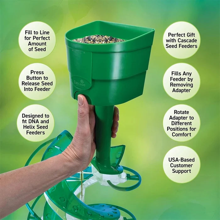 Green seed scoop with hand holding it against a green background