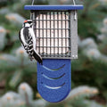 Duncraft Bird-Safe® Tail Prop Suet Feeder with blue tail support, holds a suet cake, features wire grid for clinging, and supports woodpecker feeding.