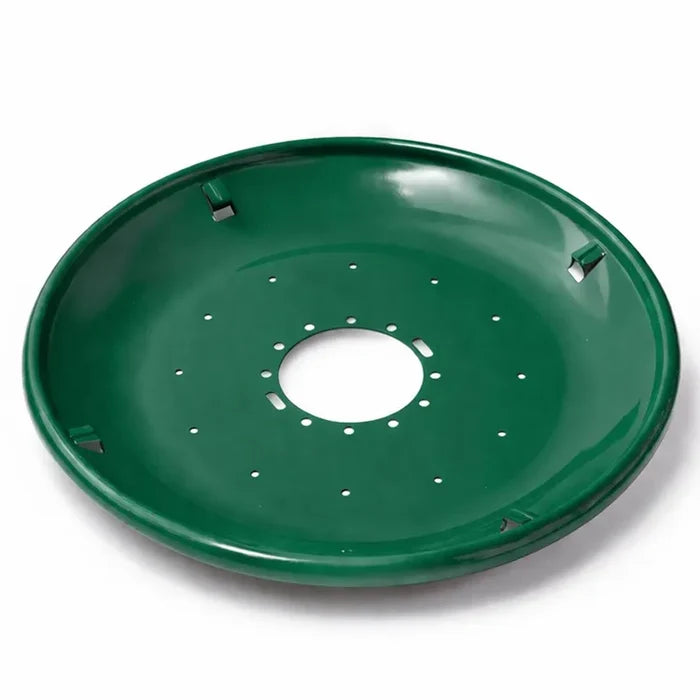 Green metal seed tray with a shallow bowl shape, central mounting hole, and multiple drainage holes, shown on a white background.