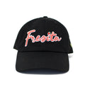 Front view of Black Fresita Dad Hat with embroidered red script and small strawberry detail on the letter i