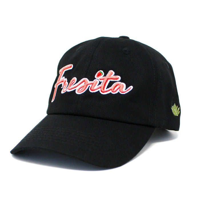 Front view of Black Fresita Dad Hat with embroidered red script and small strawberry detail on the letter i and view of the Mex West Logo on side