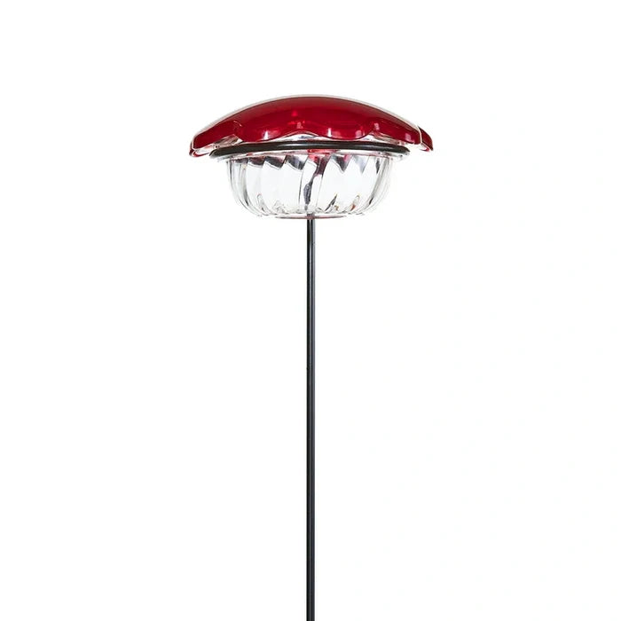 Hummingbird Plant Stick with a solar-powered red flower cap, clear lens, and black metal stake, designed to attract hummingbirds with a 3 oz. feeder capacity.