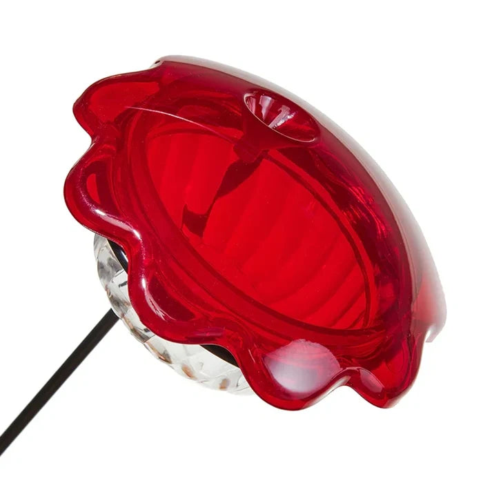 Hummingbird Plant Stick with red petal solar top and clear globe, mounted on a black stake, designed to attract hummingbirds with a 3 oz. feeder.
