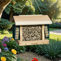 Premier Cedar Feeder with Suet Cages hangs from a tree, showcasing a wooden design with suet cages and seed block, enhancing bird attraction from all sides.