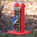 Red Arrow Whole Peanut Feeder with a blue jay eating a peanut and a finch on the tray, featuring a red house shape and wire mesh grid.