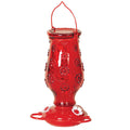 Red Floral Glass Hummingbird Feeder with red glass, white flower-shaped feeding ports, and a wire hanger for easy installation.