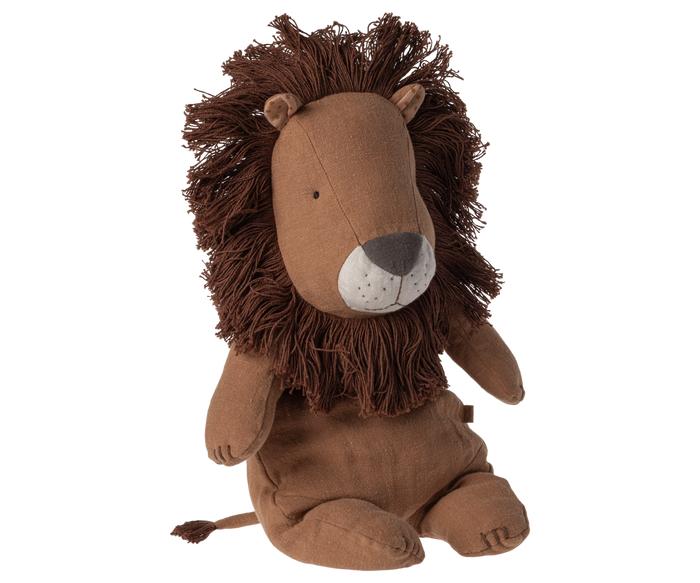 Stuffed animal in the shape of a lion sitting