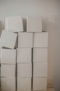 Stacked white nesting storage boxes