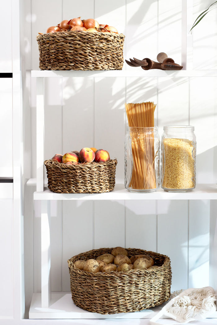 Pantry shelf with woven baskets and jars