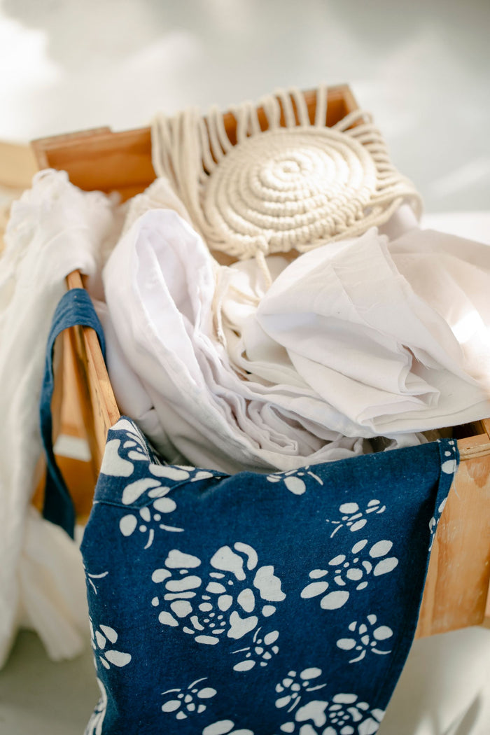 Fabric basket filled with household linens