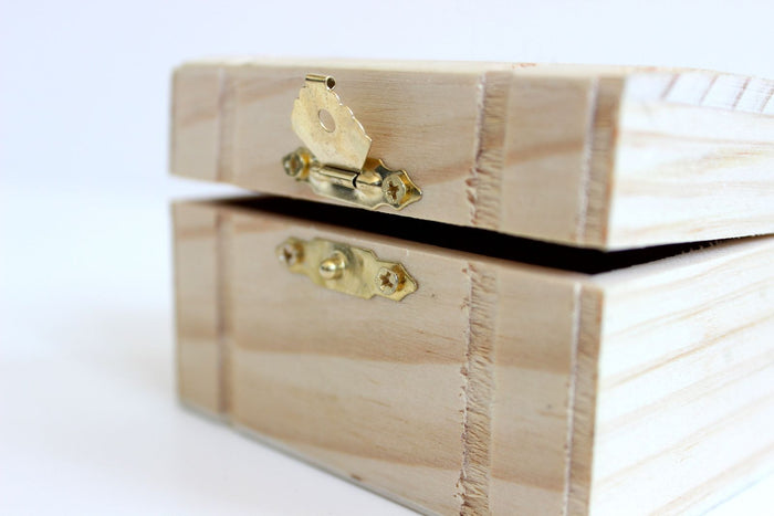 Wooden storage box with a metal clasp